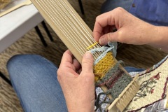 A long warp on cardboard loom
