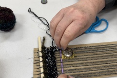 Stitching on a cardboard loom